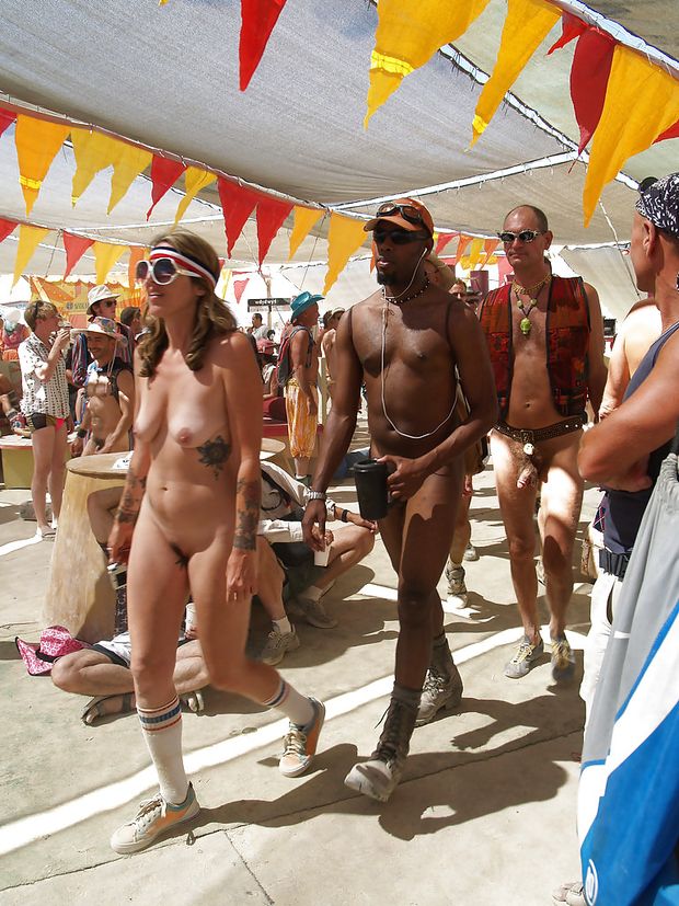 She parades nude at Burning Man.