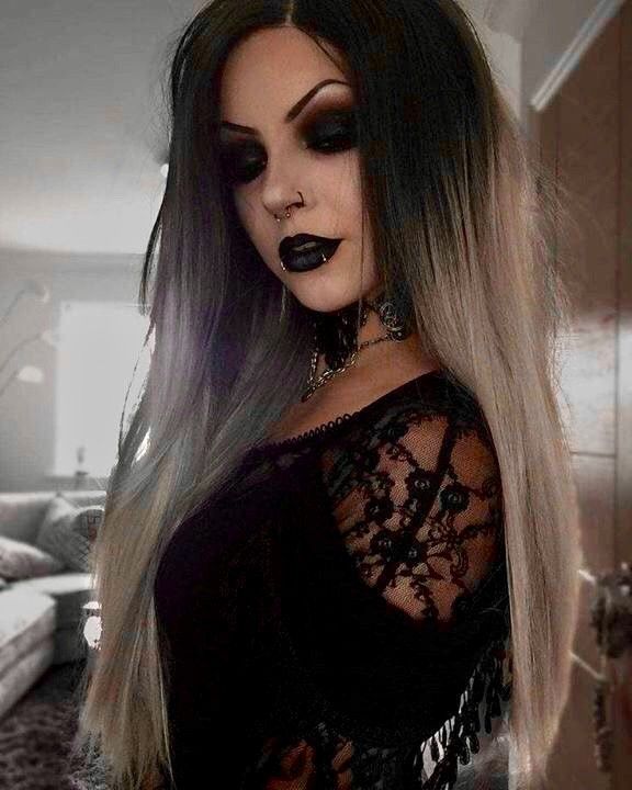 Beautiful goth chick taking a selfie.