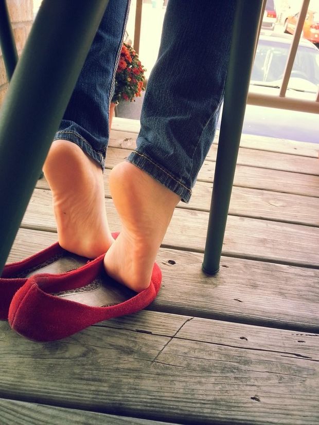 Bare feet slipping out of shoes.