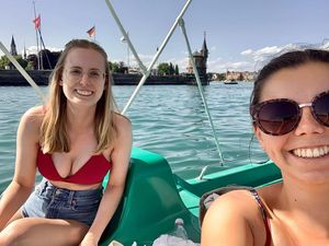 Gentiana and her friend on a boat