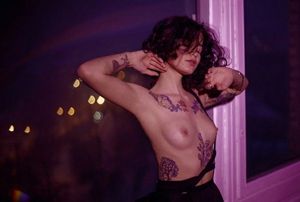 nice tits with tatoo purple light