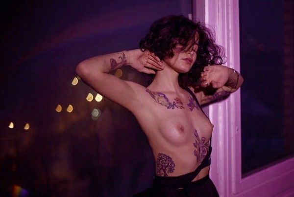 nice tits with tatoo purple light