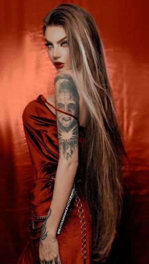 Dangerously Beautiful Blonde, with tattoo of classic horror movie character Pin Head, from Hell Raiser.