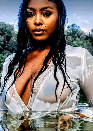 Sexy ebony hottie with wet T-shirt sporting sexy nipples