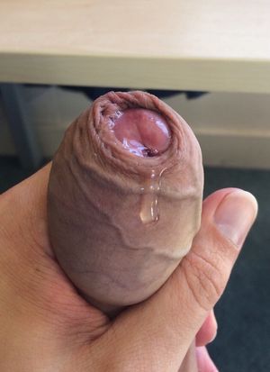 Squeezing out some precum