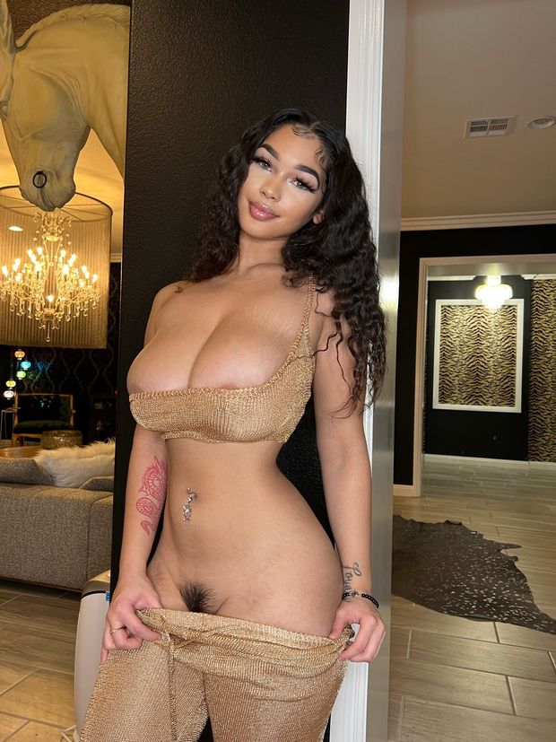 Lexie in gold showing pussy hair