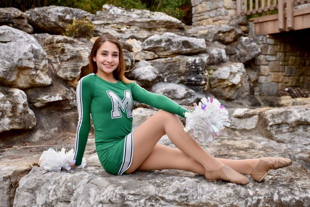 Leggy brunette representing Michigan State.