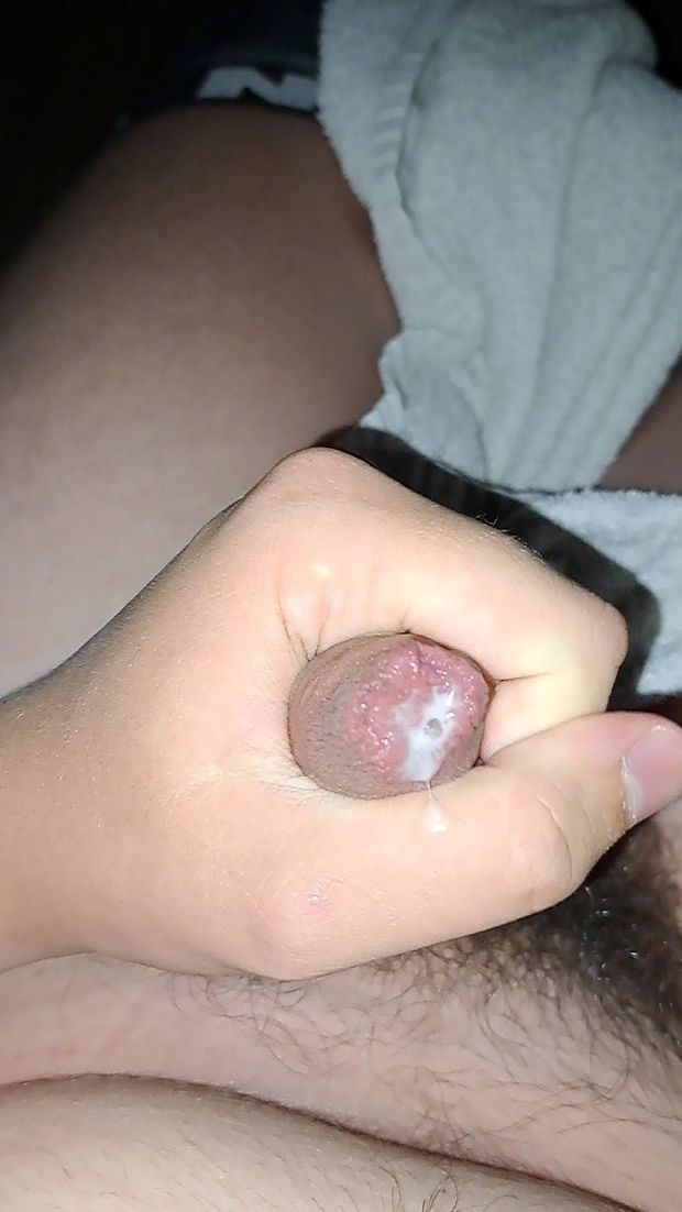 Foamy saliva and precum on an uncut penis