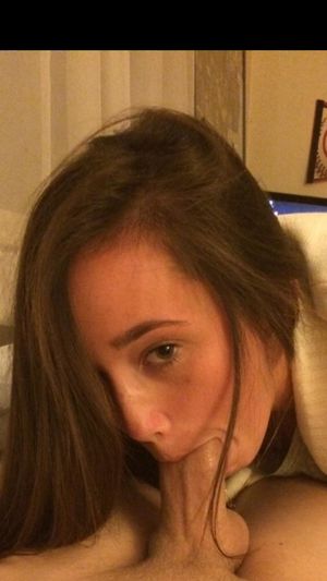 Amateur brunette attempting to shove as much dick in her mouth as she can