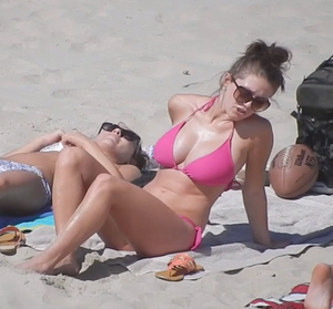Insanely big tits capured from a spy cam on a beach
