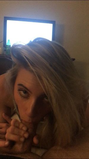 Amateur blond looking up with an average-sized cock in her mouth