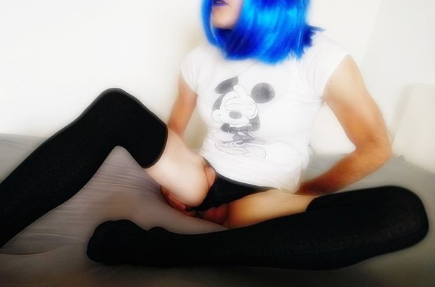 Sissy Sandy Blue showing her Sissy-Clit between her long legs