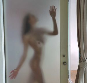 Behind the shower door….she is waiting