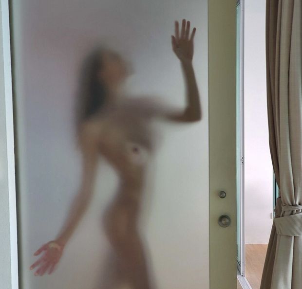 Behind the shower door….she is waiting