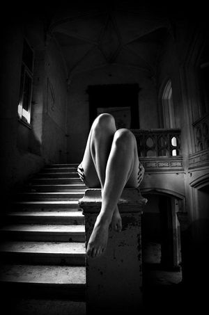 Model in an abandoned building