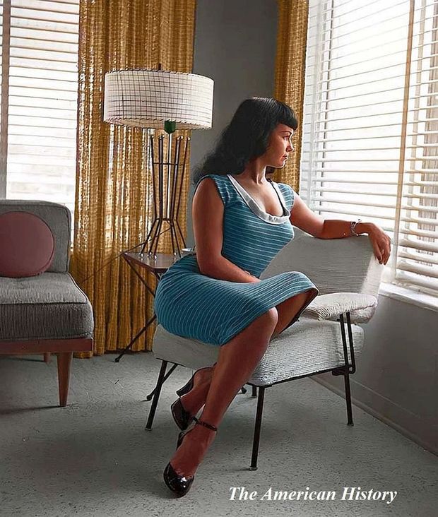 Bettie Page - blue dress, seated