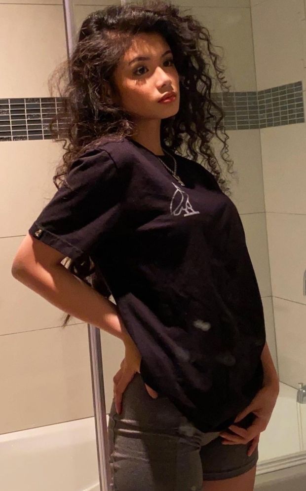 Sam curly hair in bathroom