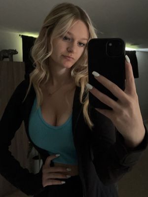 Blonde selfie in blue top