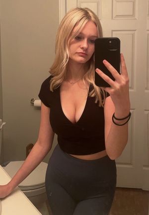 Blonde bathroom selfie cleavage popping