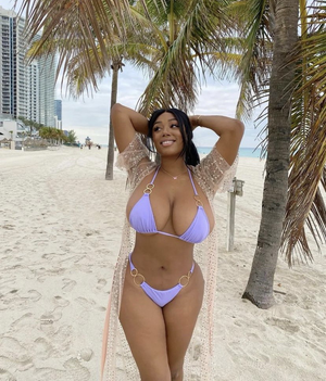 Beautiful Black Queen in a Purple bikini