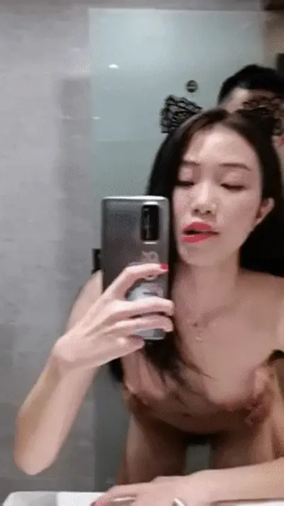 Asian in cat ears selfies as she gets fucked from behind