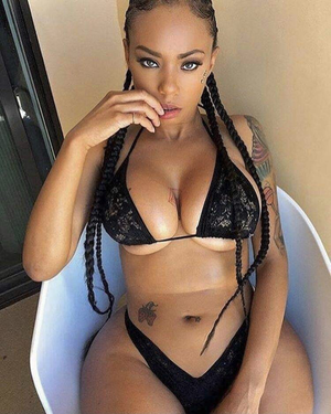 I see a strawberry tattoo on her stomach…