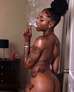 Cute Black woman smoking a blunt