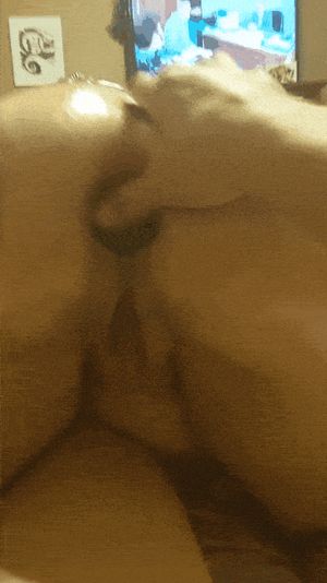 Plugged, oiled ass and pierced pussy massaged