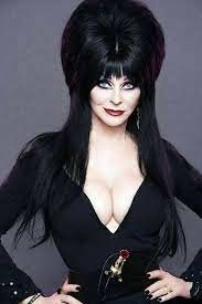 Elvira showing her incredible cleavage