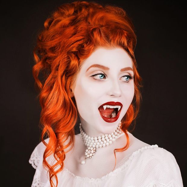 Vampiress with locks of flaming red hair