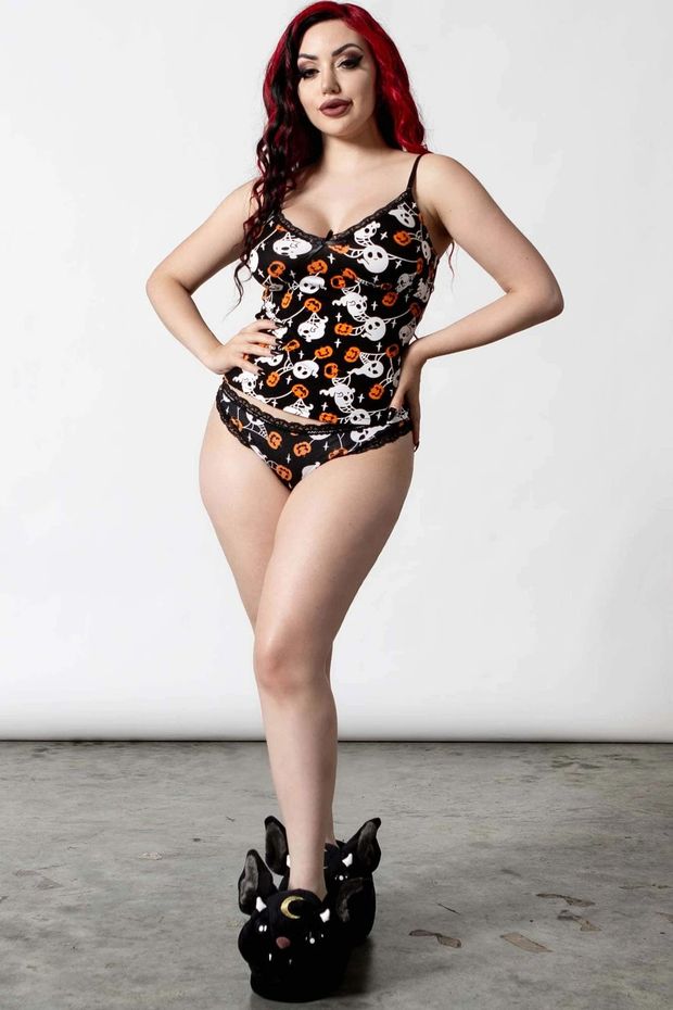 Dani Divine, goth model, in pajamas and slippers