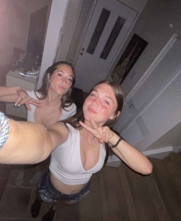 2 teens hallway selfie