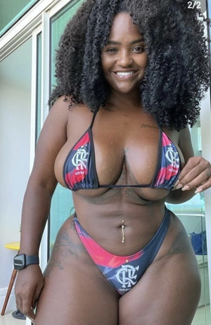 Thick Black woman in bikini with tattoos