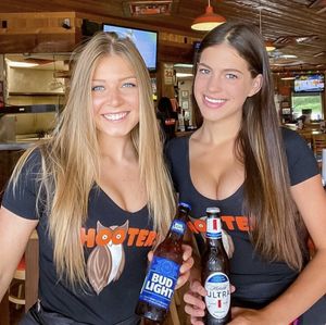 Your favorite Hooters gal and her big tit friend