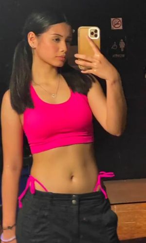 Sam pigtails selfie in pink