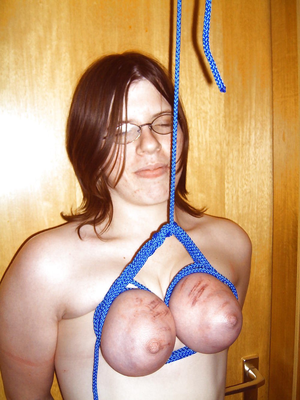 Slave's tits bound and bruised from punishment