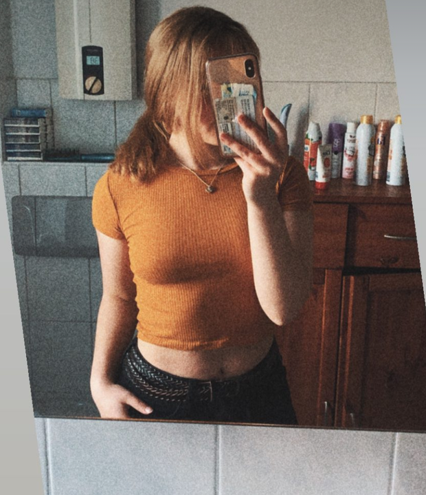 Blonde teen in tight orange shirt