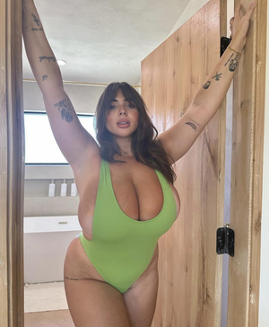 Hot Brunette Spilling Out of Her Bikini