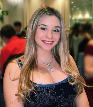 Kate in dress showing cleavage