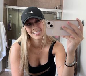 Blonde bathroom selfie tongue out