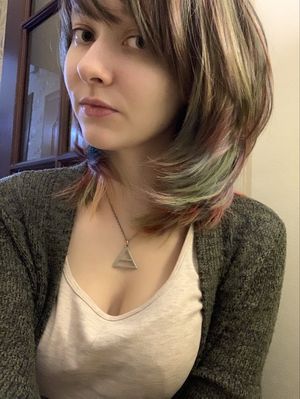 She likes her new haircut--but you can see those tits are great