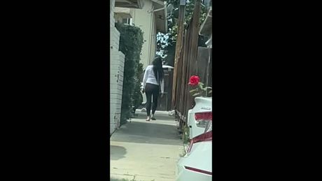 Sexy Asian walking in leggings