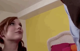 Scared redhead in pigtails