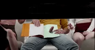Sharing a handjob under the table