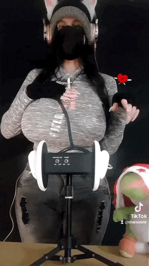 Shara ASMR using a stethoscope on herself