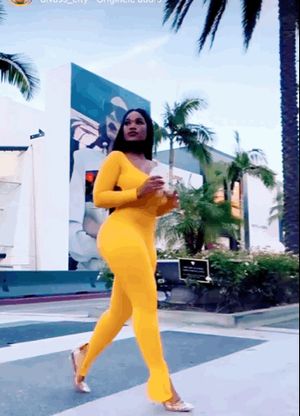 Stunning ebony queen in yellow bodysuit
