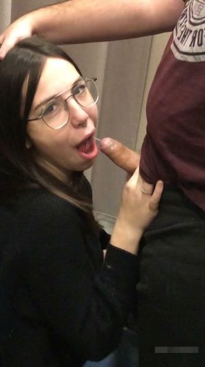 Brunette amateur with glasses sucking on a small dick in the mirror