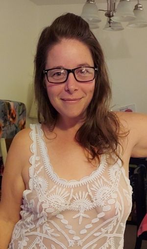 Hot nerdy milf showing off her titties