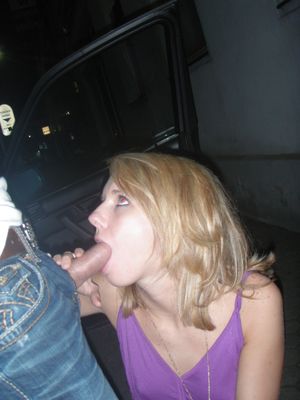Amateur blond hopping out of the car to blow a guy