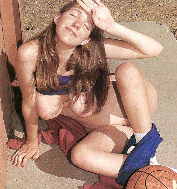 Marie shielding eyes and showing boobs